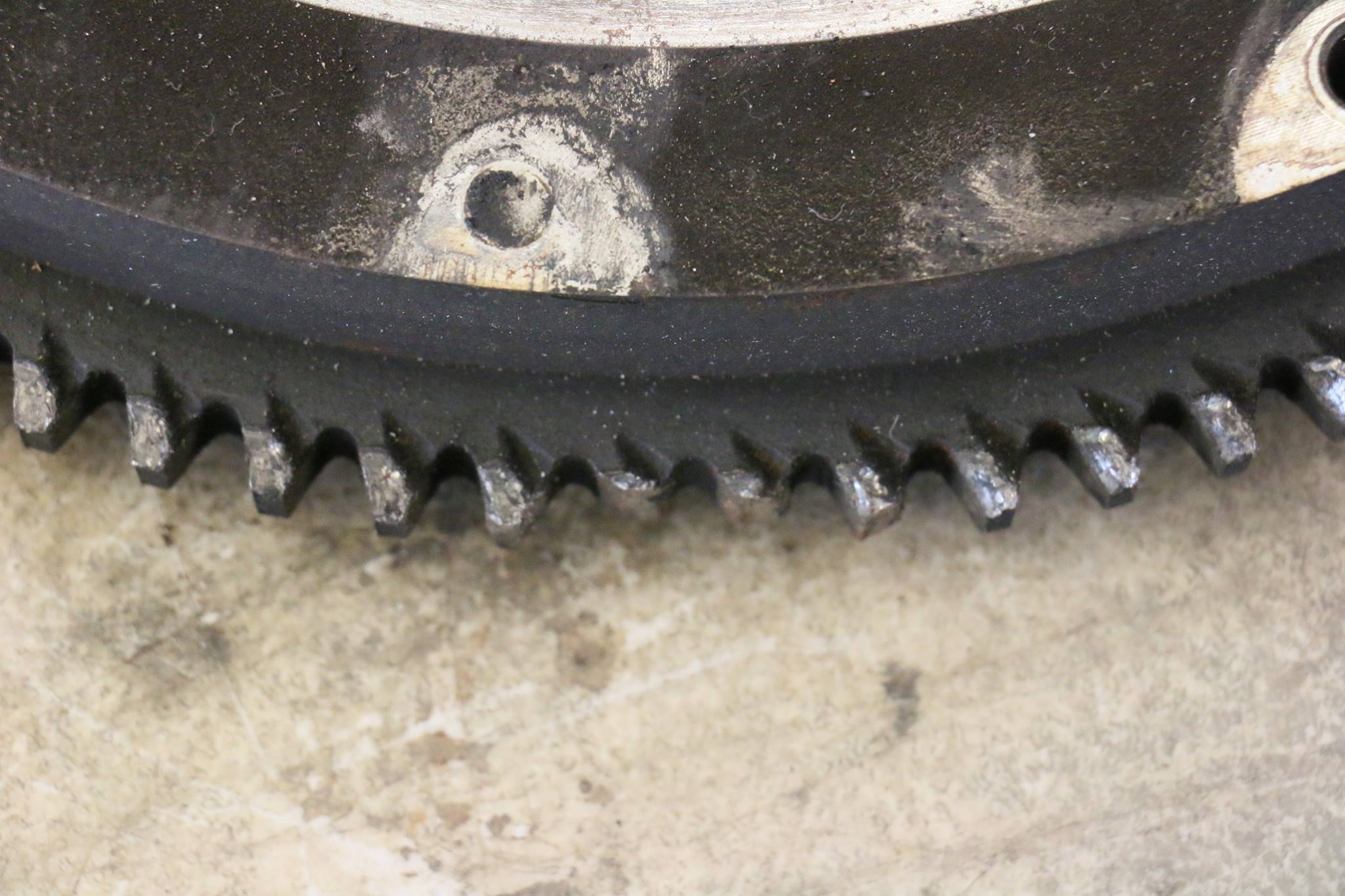 This caused damage to the flywheel gear. Two of the teeth are broken off.