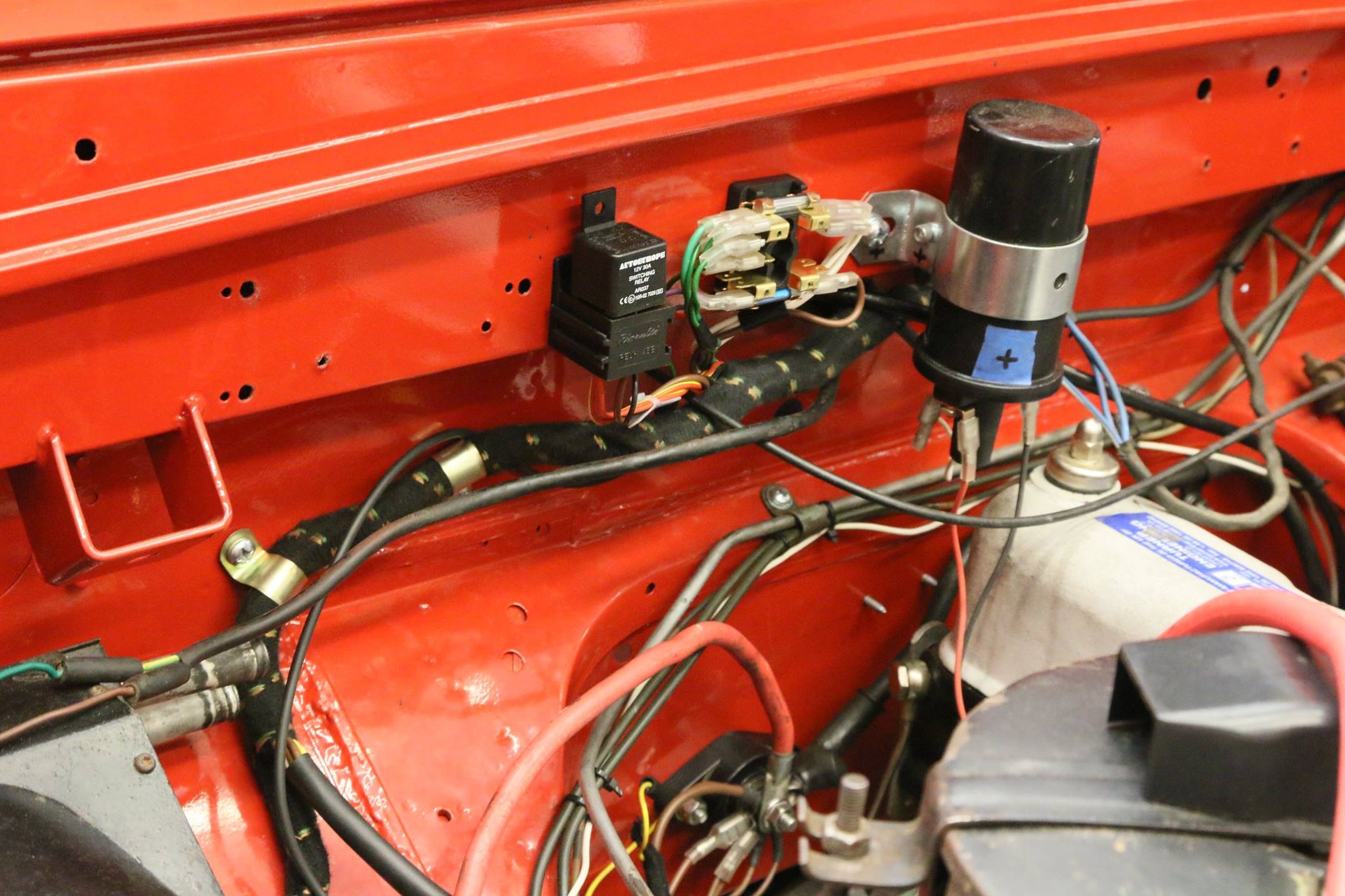 The new wiring harness is a cloth covered unit just like the factory one but was designed for an alternator instead of a generator. We had it made with a front fog light circuit with a relay built in to the harness.