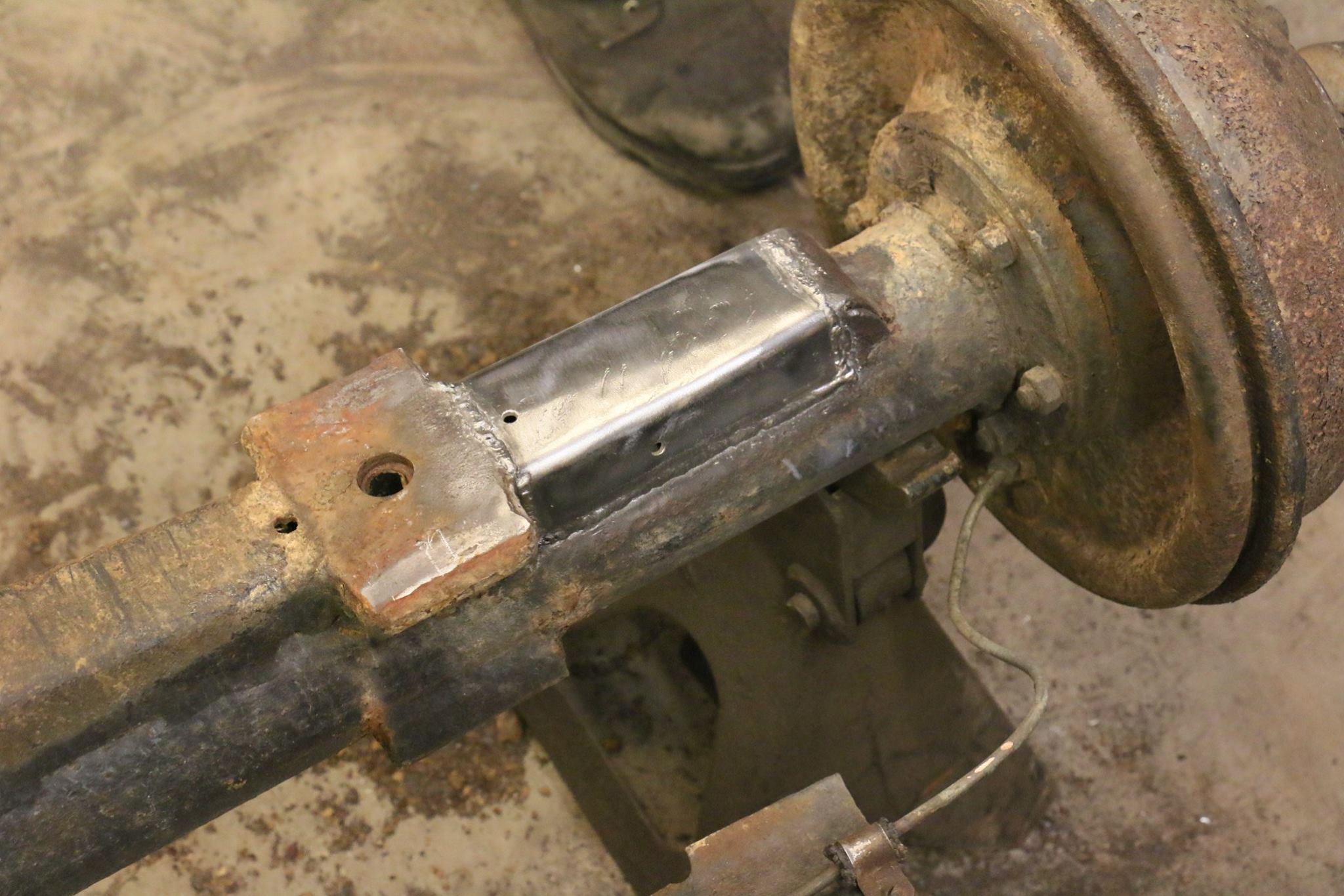 The rotted rear axle truss is repaired.