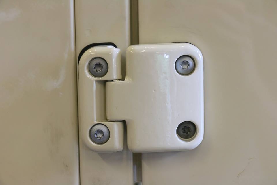 New genuine Land Rover rust resistant door hinges are installed with galvanized hardware.