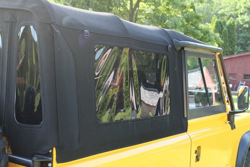 Unlike the original soft top, this one has a full gutter kit around the doors to keep rain and wind out. It also has tinted windows and roll up sides.